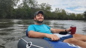 Off the Rails Founder Chris enjoying tubing, as Off the Rails Kombucha is all about adventure.