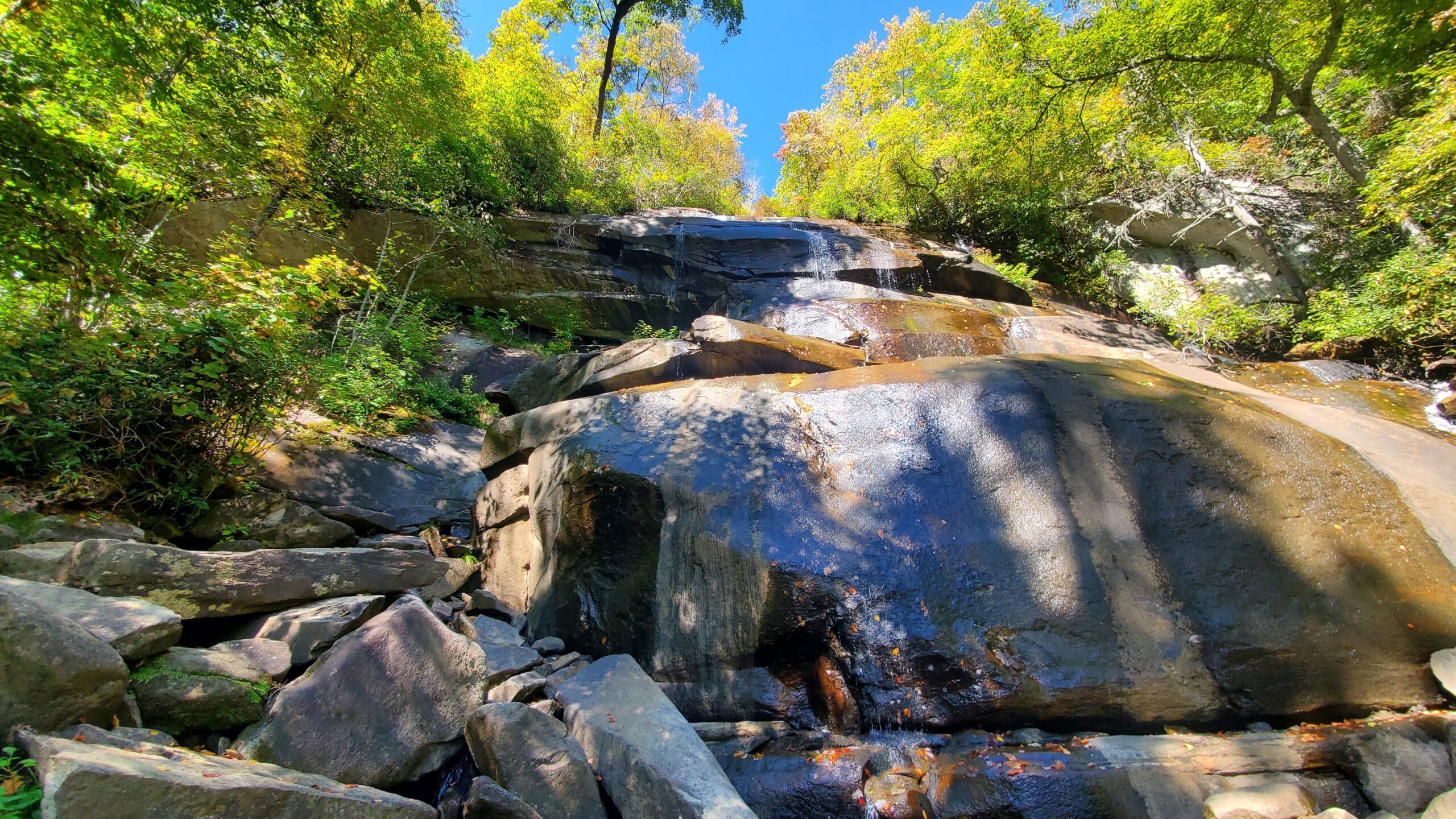 A colorful waterfall picture to show our adventures hiking to waterfalls in South Carolina and North Carolina.